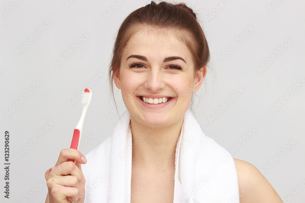 Beautiful woman with a great smile holding toothbrush Beautiful woman with a great smile holding toothbrush