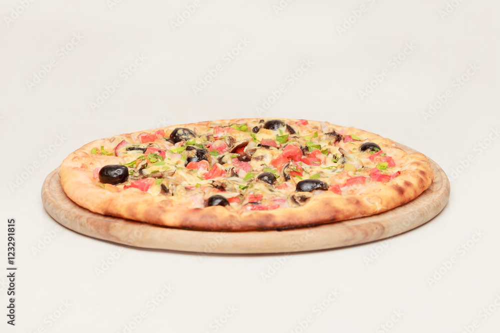 Tasty pizza with vegetables, chicken and olives