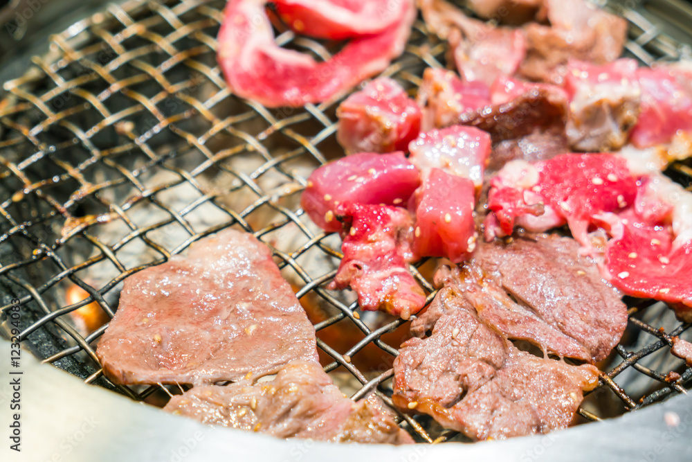 Japanese style Raw fresh beef on hot barbecue grill . Japanese style Raw fresh beef on hot barbecue grill .