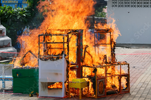 Chinese ceremony burn gold paper and useful things to ancestor.