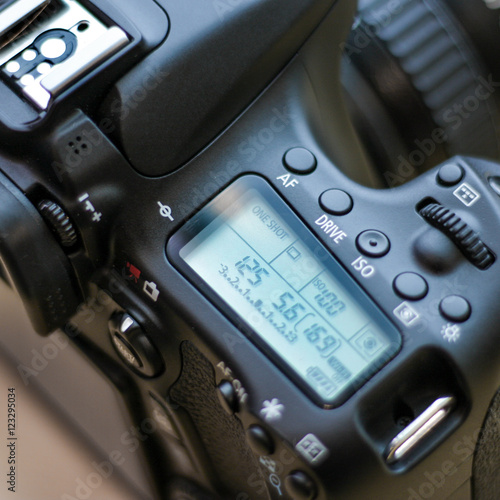 Close up of DSLR camera with settings display photo