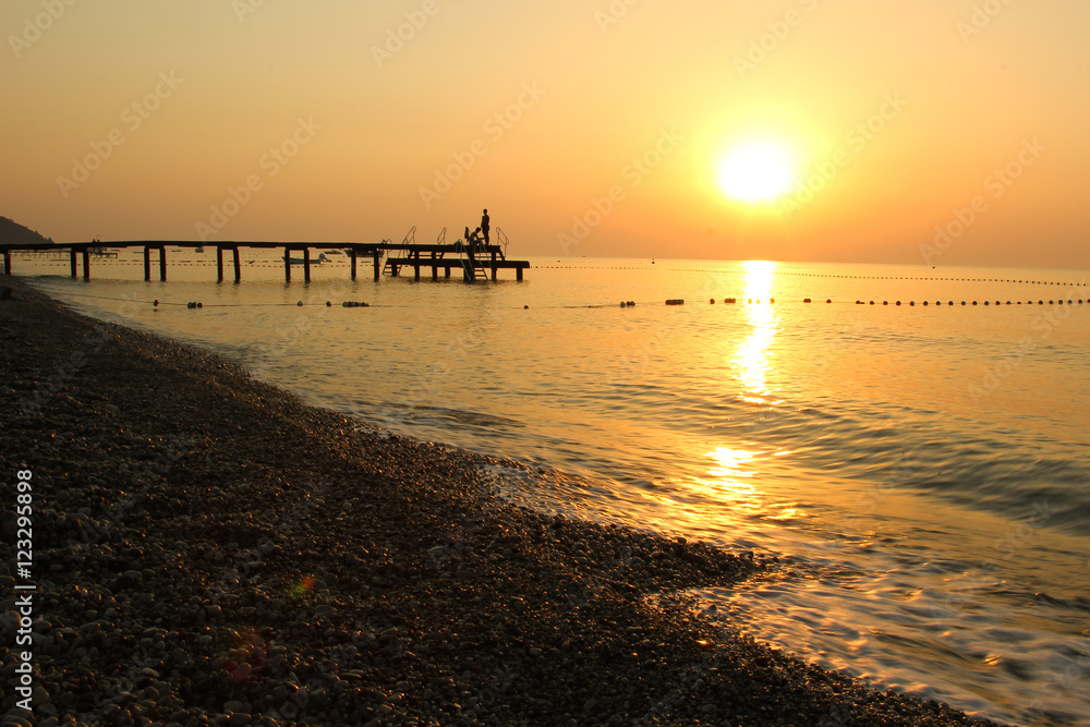 Beautiful sunrise on the beach in the Mediterranean sea