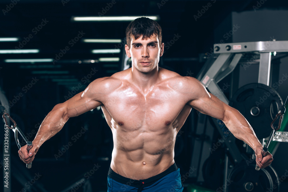 handsome bodybuilder works out pushing up excercise in gym handsome bodybuilder works out pushing up excercise in gym