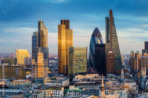 London, England - Business district with famous skyscrapers and landmarks at golden hour photo
