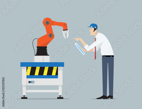 Industry 4.0 Factory Automation Concept. Robot hands controlled by engineer with Tablet PC. .