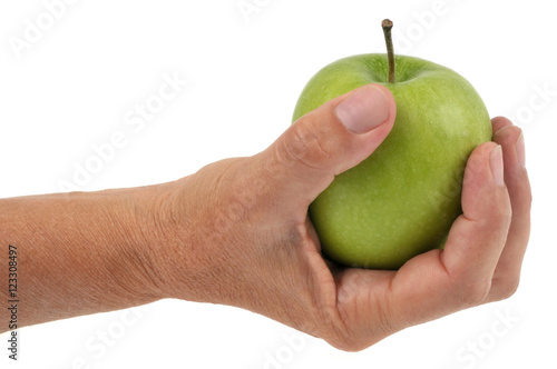Pomme verte tenue en main
