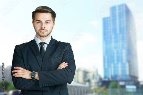 Businessman on blurred buil...