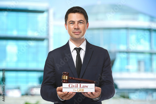 Handsome man with law books...