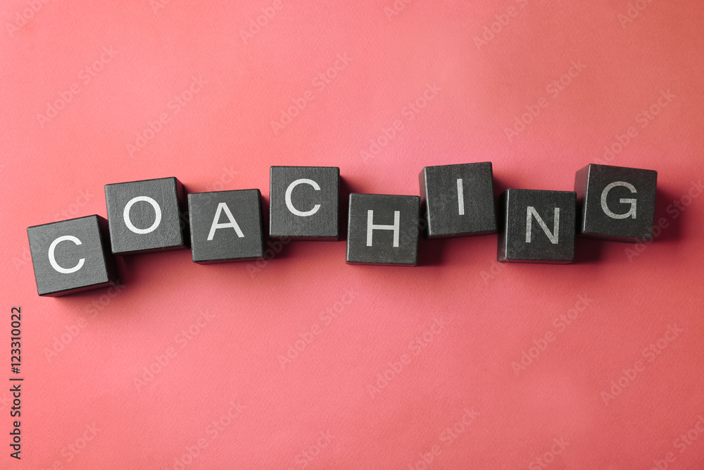 Obraz premium Coaching concept. Wooden cubes on pink background