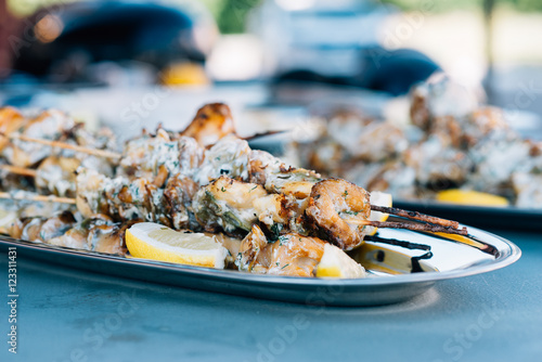 Fototapeta Naklejka Na Ścianę i Meble -  Grilled shellfish with lemon served on silver plate