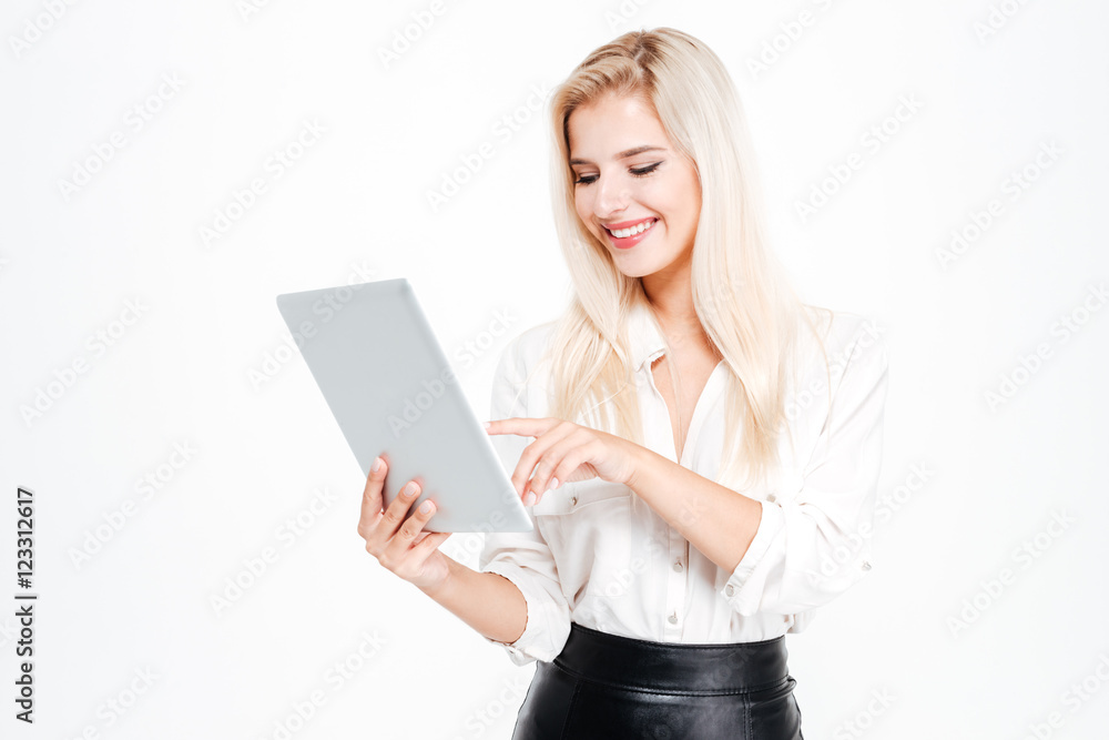 Beautiful happy businesswoman using tablet computer Beautiful happy businesswoman using tablet computer