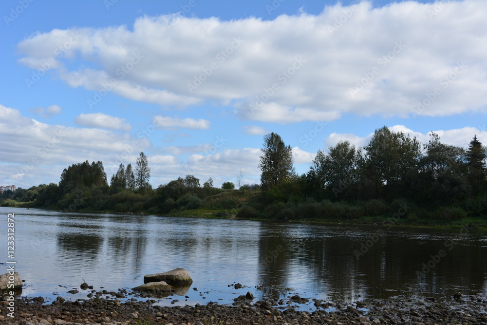 beautiful landscape: the river and the blue sky with clouds