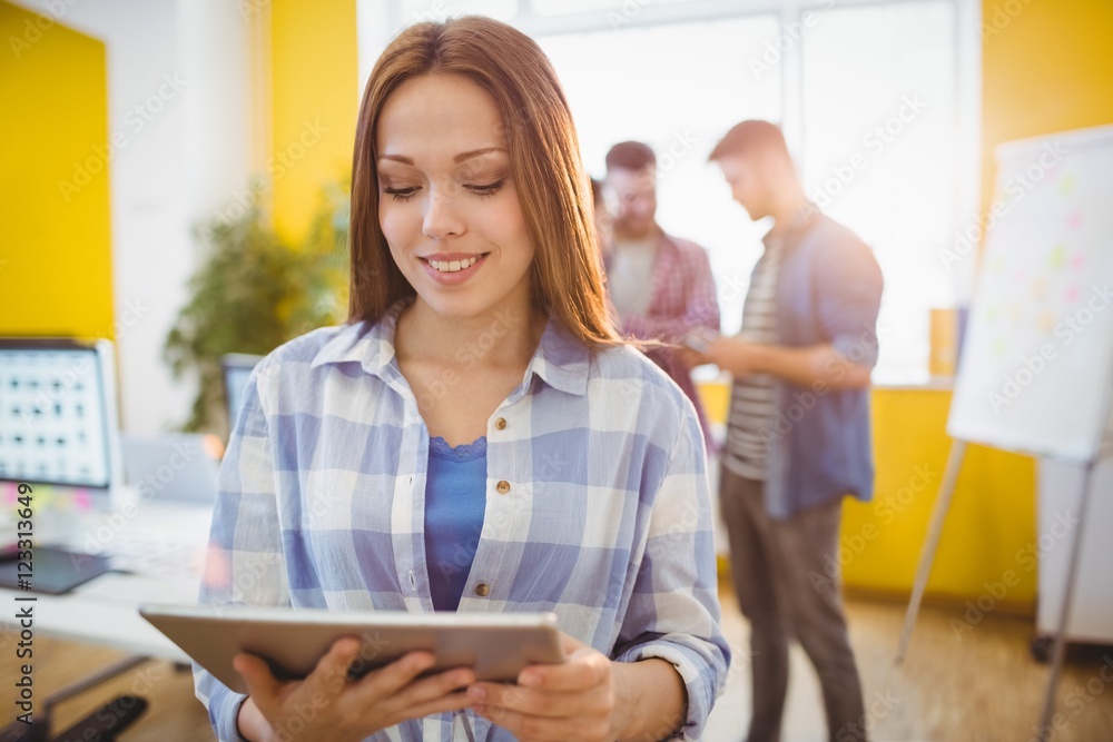 Businesswoman using digital tablet coworkers Businesswoman using digital tablet coworkers