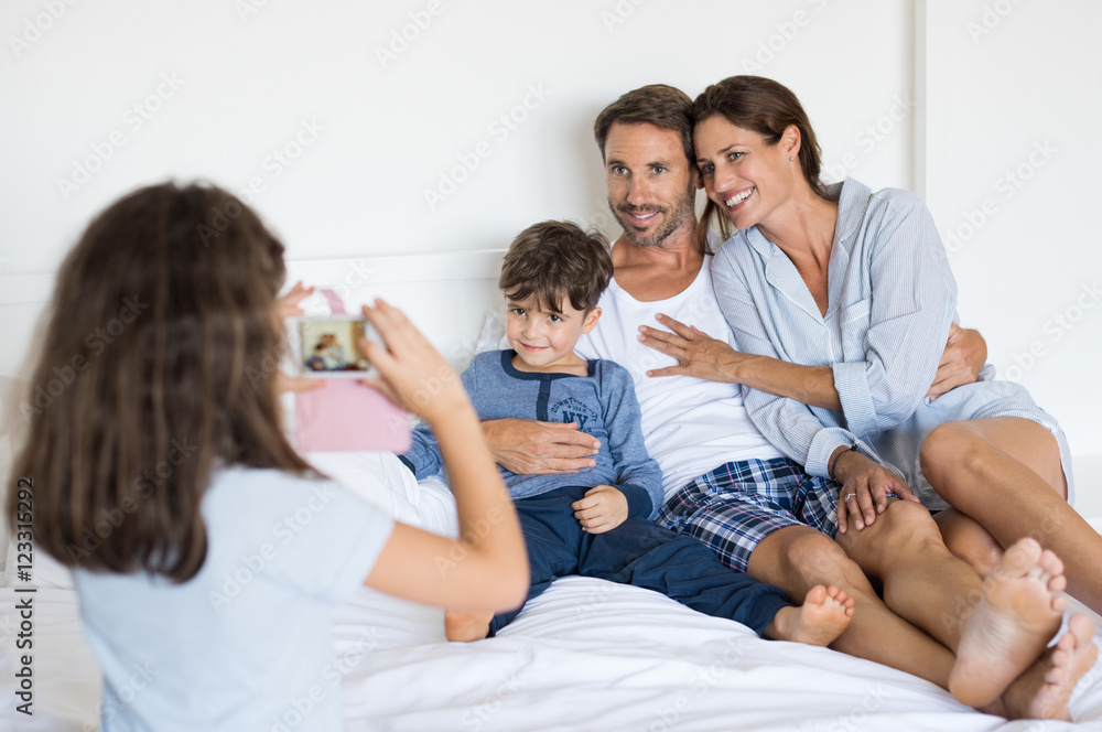 Daughter takes a photo of her family Daughter takes a photo of her family