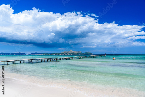 Canvas Print Pier at Playa Muro - beautiful beach on Mallorca, balearic island of spain