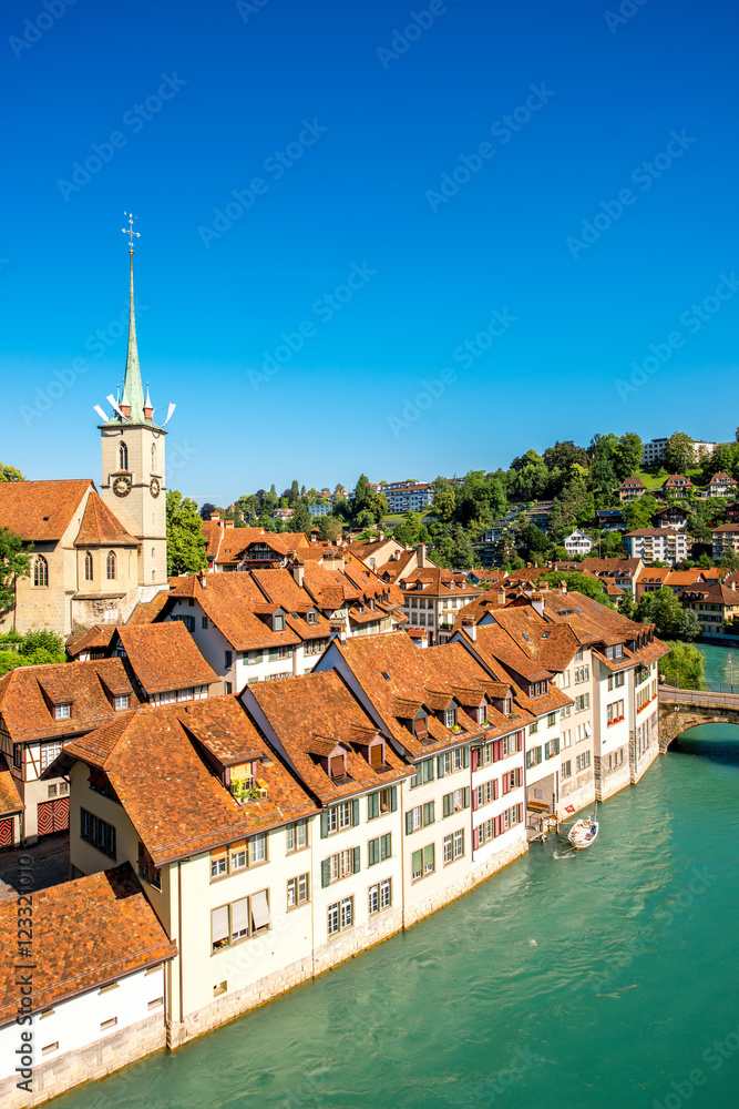 Cityscape view on the old town with Nydegg church tower and the river in Bern city in Switzerland