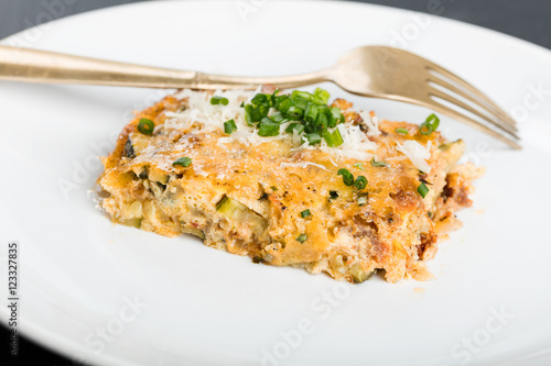 Vegetables casserole with cheese and chives