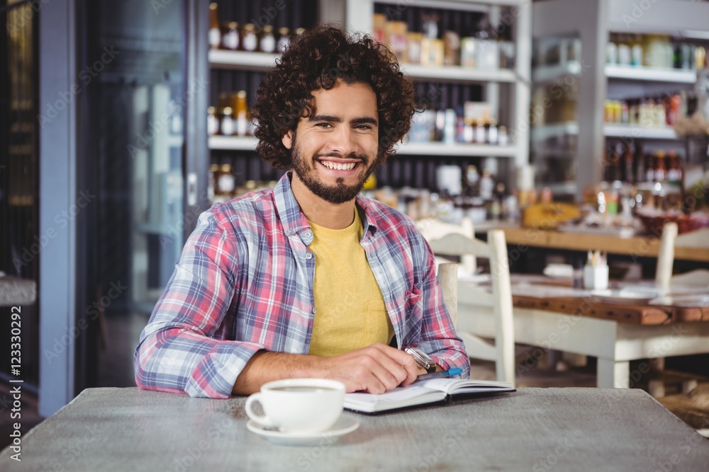 Fototapeta premium Portrait of man with a diary