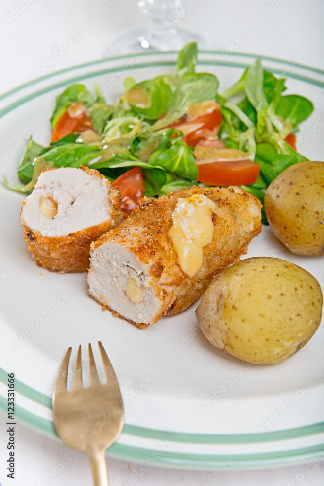 Kiev cutlet with jacket potatoes and salad Kiev cutlet with jacket potatoes and salad