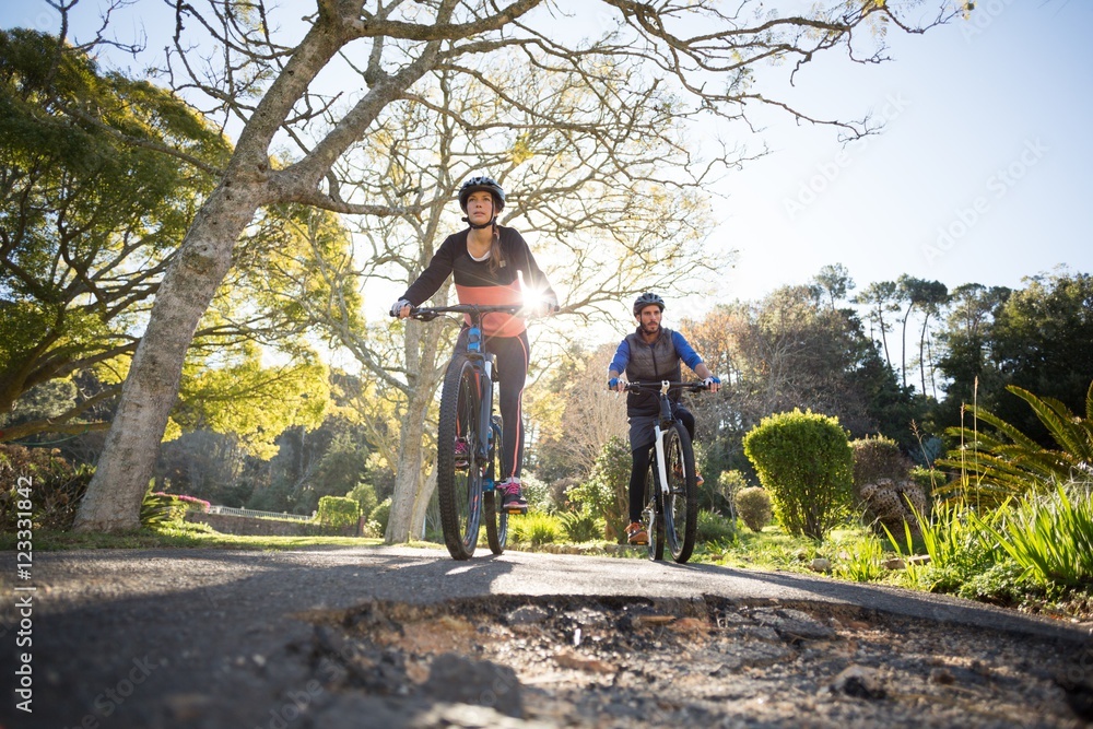 Fototapeta premium Biker couple cycling on the countryside road