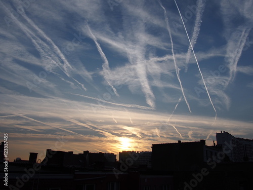 con trails and sunrise glow