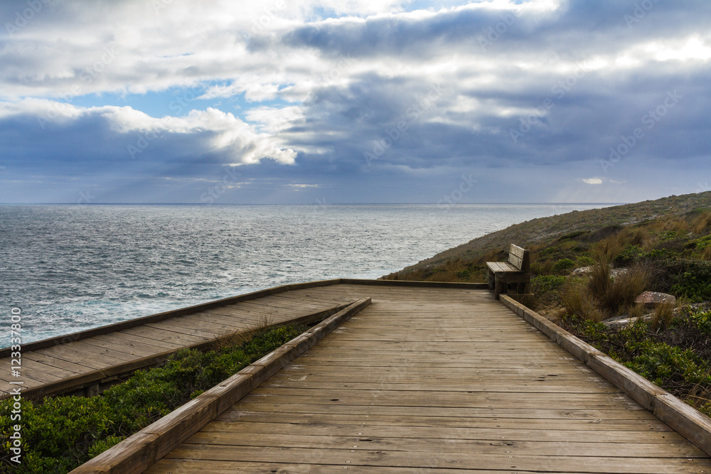 Stormy clouds with a wooden walkway in Australia, Kangaroo Island
