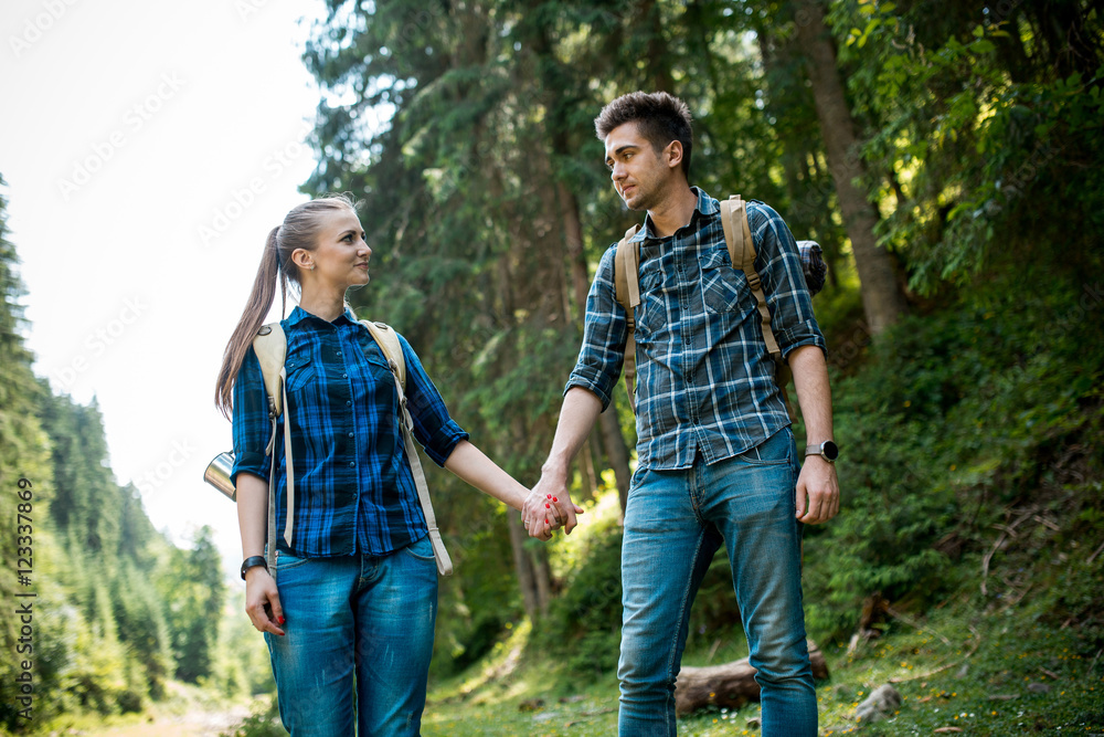 A guy and a girl tourists they go camping in the mountains A guy and a girl tourists they go camping in the mountains