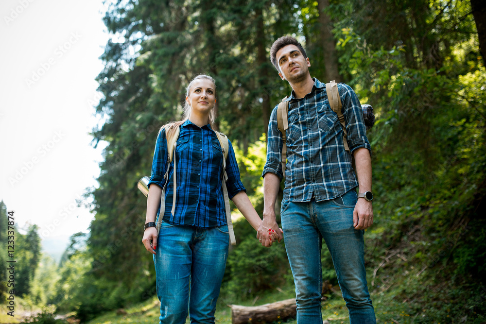 A guy and a girl tourists they go camping in the mountains A guy and a girl tourists they go camping in the mountains