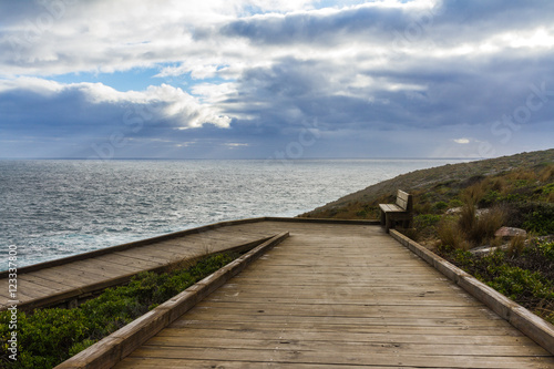 Stormy clouds with a wooden walkway in Australia, Kangaroo Island