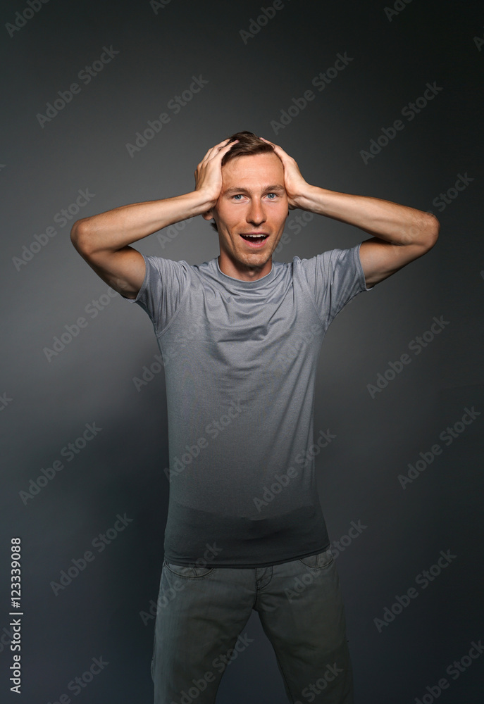 Portrait of a surprised caucasian man with hands on head. Portrait of a surprised caucasian man with hands on head.