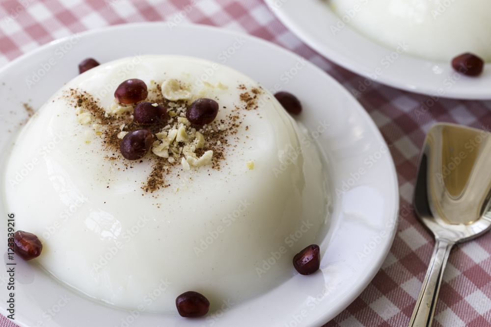 Fototapeta premium Custard pudding with pomegranate