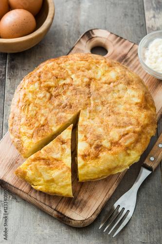 Traditional spanish omelette and wine on wooden table

