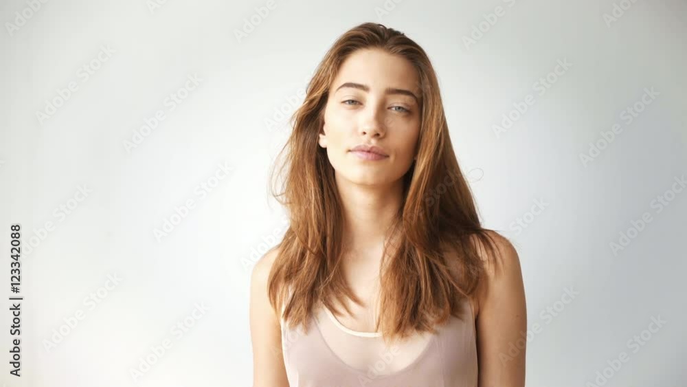Portrait of attractive skinny girl lookingin camera and smiles Portrait of attractive skinny girl lookingin camera and smiles