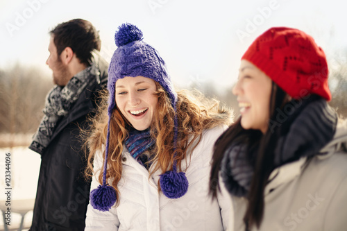 Group of friends enjoying hanging out in winter