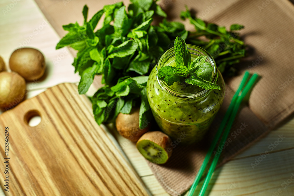 Fresh green smoothie with kiwi and mint . Love for a healthy raw food concept. Healthy eating. Fruit Smoothies. Kiwi. Fresh green smoothie with kiwi and mint . Love for a healthy raw food concept. Healthy eating. Fruit Smoothies. Kiwi.