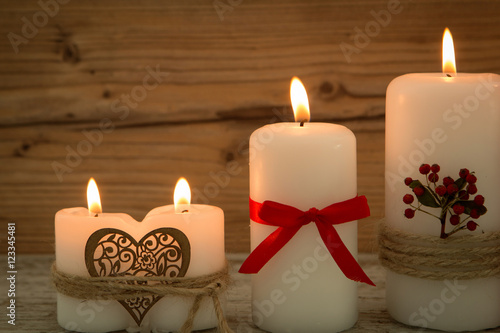 Elegant candles decorated for Christmas