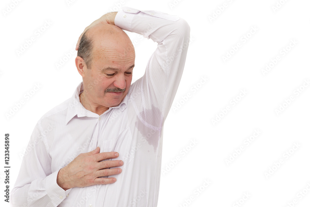 Sweaty spot on the shirt because of the heat, worries and diffidence. Elderly people suffering from the heat and stuffiness Sweaty spot on the shirt because of the heat, worries and diffidence. Elderly people suffering from the heat and stuffiness