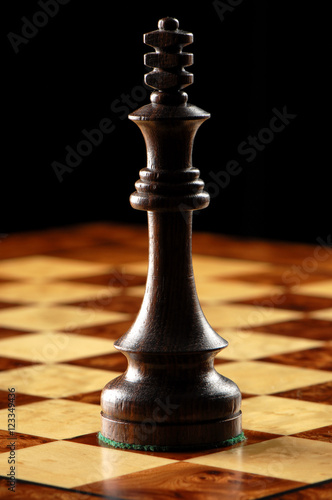 Black King Chess Piece on Chessboard