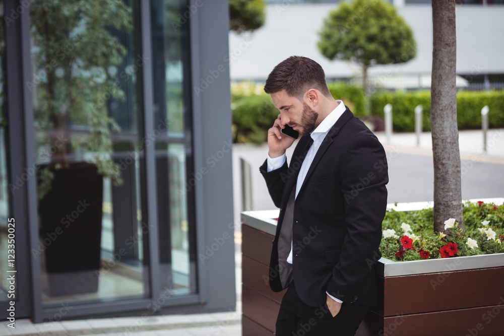 Businessman talking on mobile phone Businessman talking on mobile phone