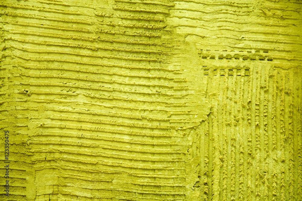 Obraz premium Yellow textured cement wall