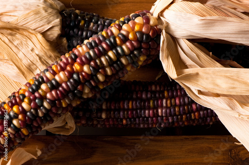 Decorative Indian Corn Maze on Weathered Wooden Crate photo