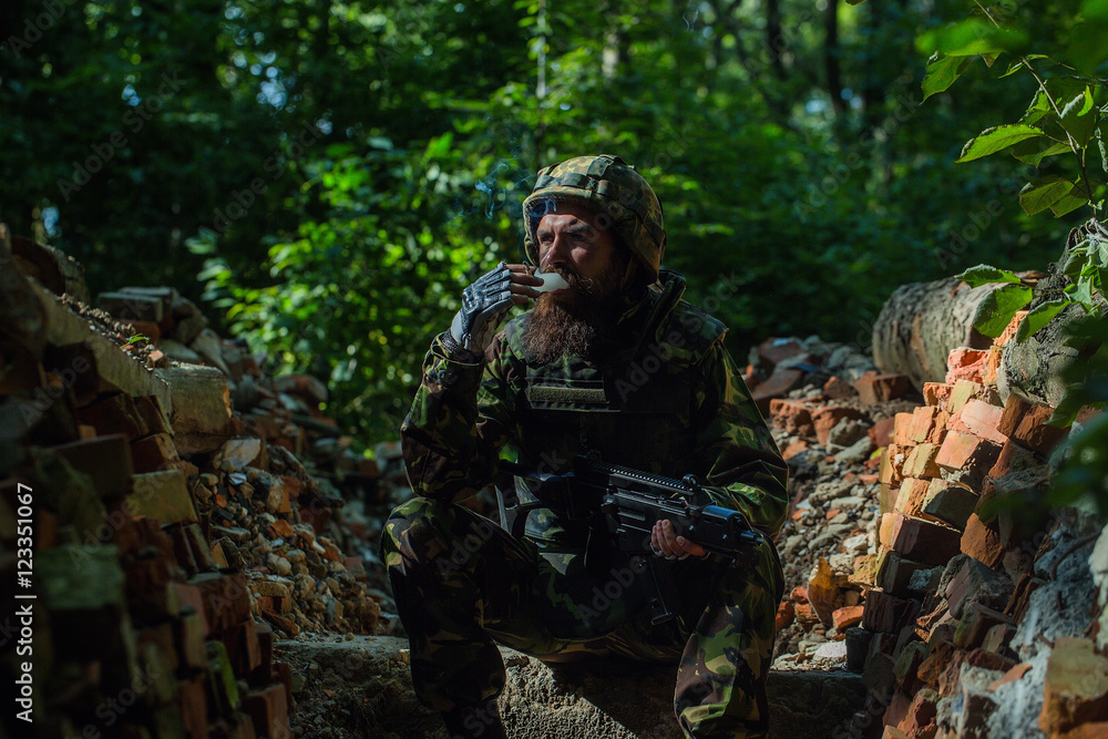 Soldier in the barricade with the gun