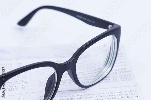 Finance Concepts, glasses with passbook as background