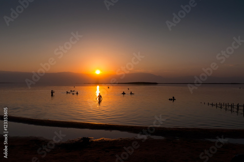 People floating at the Dead sea at dawn  Israel