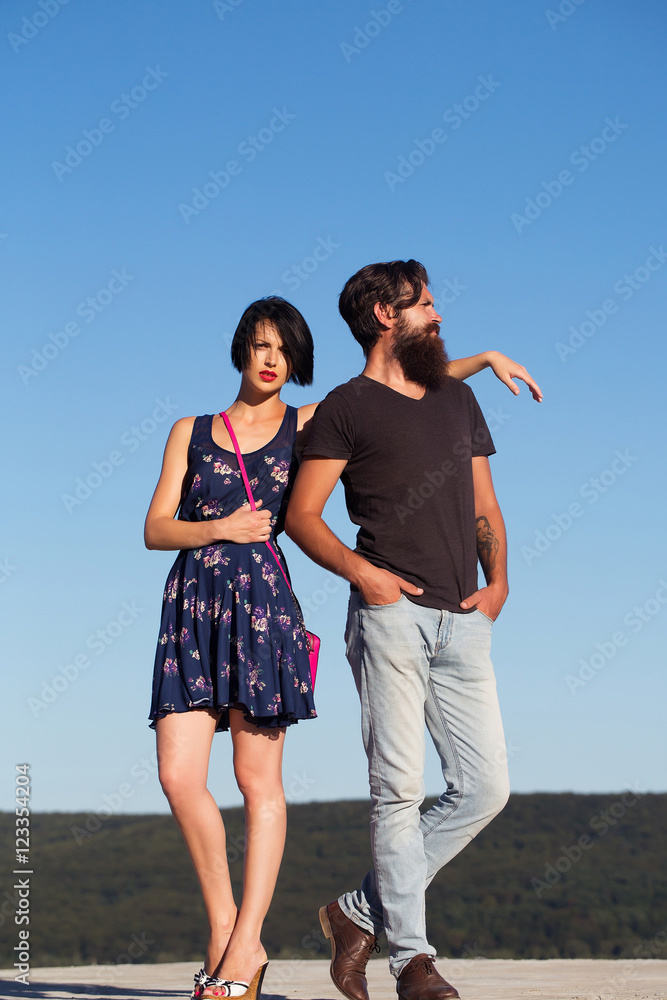 Couple pose on blue sky Couple pose on blue sky