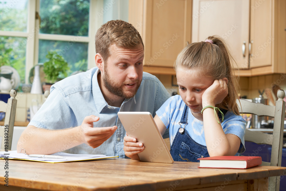 Male Home Tutor Helping Girl Struggling With Studies