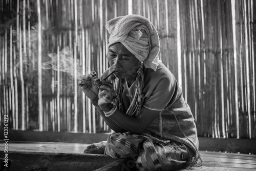 Quadro em tela Female karen hill tribe is smoking tobacco pipe traditional in the cottage of northern Thailand at Mae Klang Luang, Mae Chaem, Chiang Mai Province