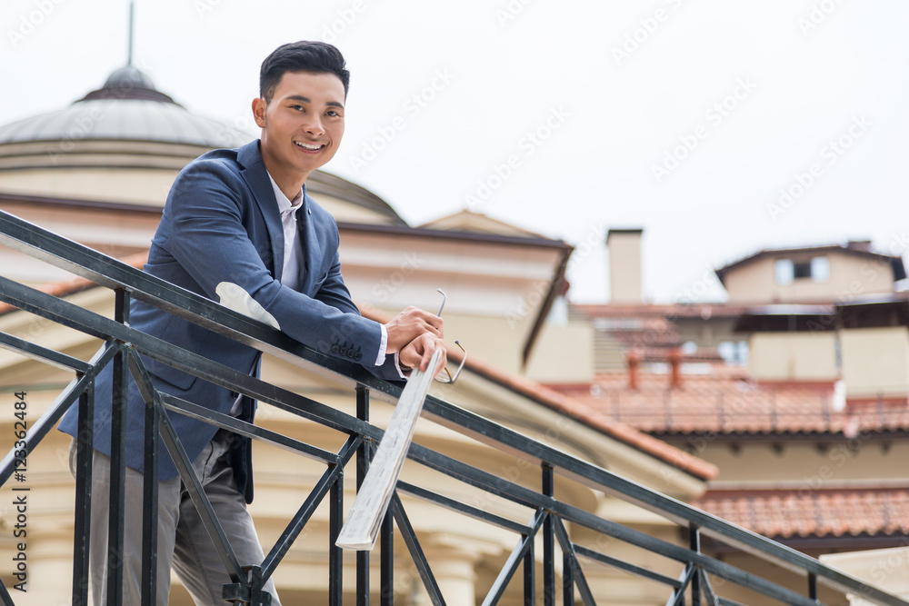 Asian businessman enjoying the weather