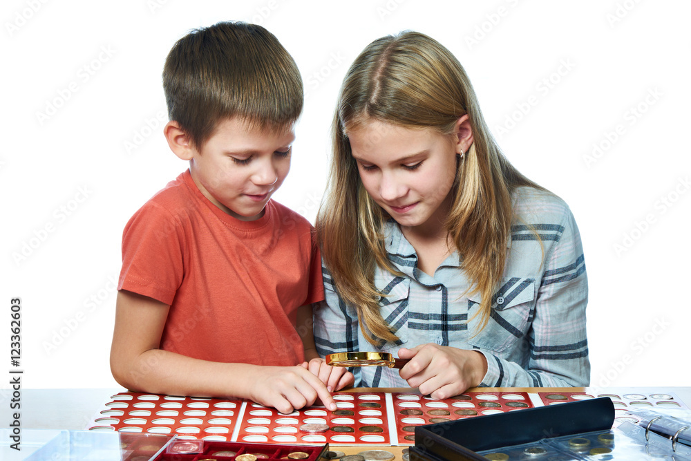 Fototapeta premium Boy and girl are considering coin collection isolated