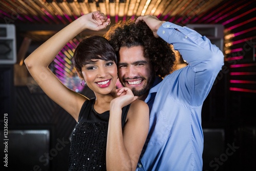 Cute couple dancing together on dance floor